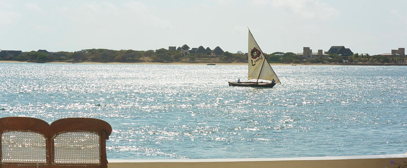 traditional boat sailing on the ocean off Lamu in Kenya