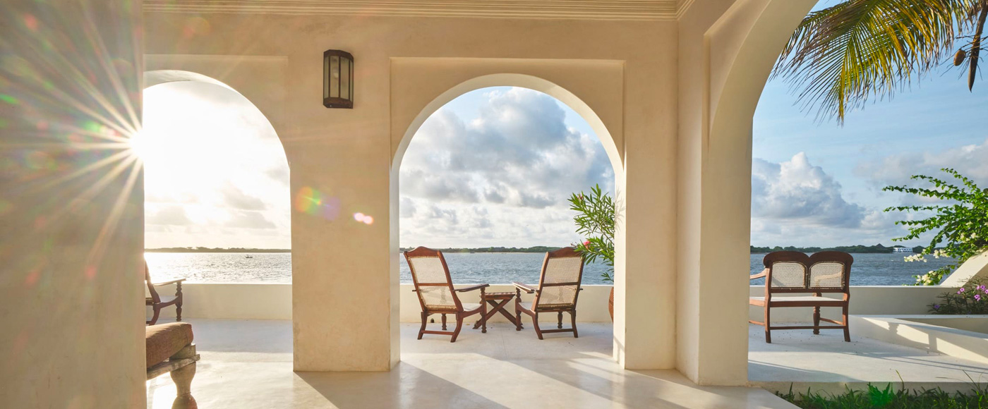 arched terrace of the villa in Shella Beach on Lamu Island in Kenya with sea view in the sunlight